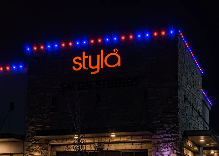 Salon storefront with blue and red permanent lights