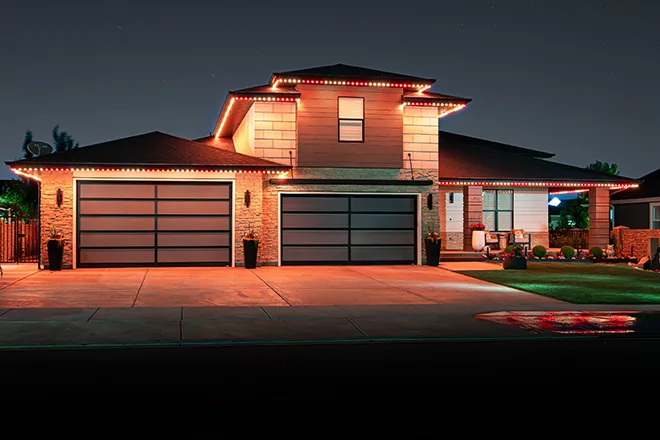 Orange and red permanent lights on a modern home