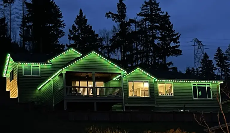 Two-story home with permanent roofline lighting in Olympia, WA