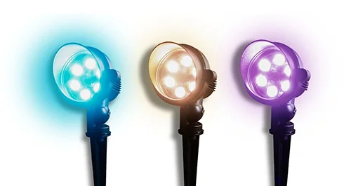 Three landscape spotlights in blue, warm white and purple