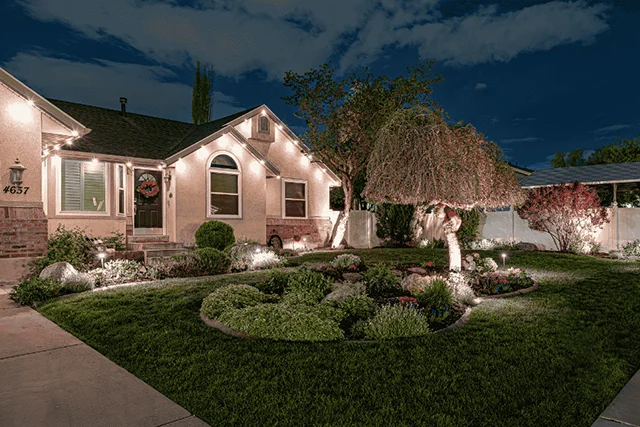 Warm white landscape lights in a ranch home front yard